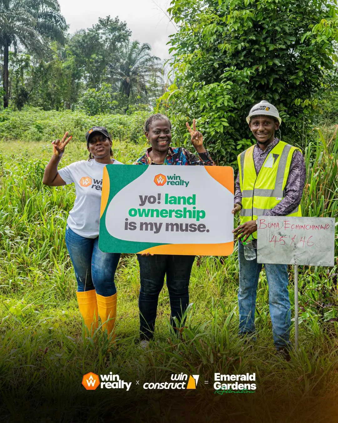 Women celebrating land ownership with Win Realty team in lush green landscape